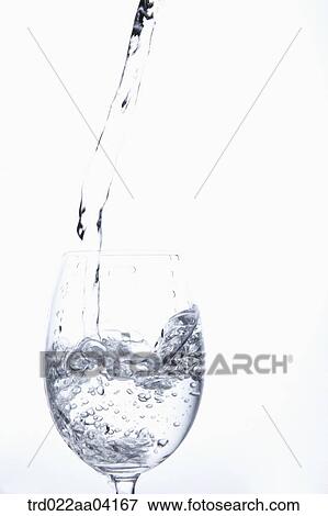 Stock Photo - Pouring water into the glass. Fotosearch