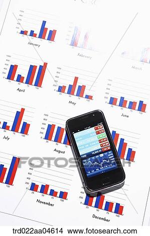 Picture - Smartphone and chart . Fotosearch