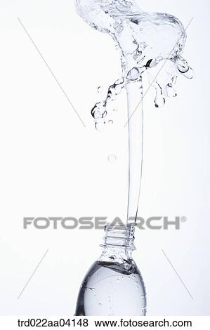 Spring up water from the bottle View Large Photo Image Stock Photo - Spring up water from the bottle. Fotosearch