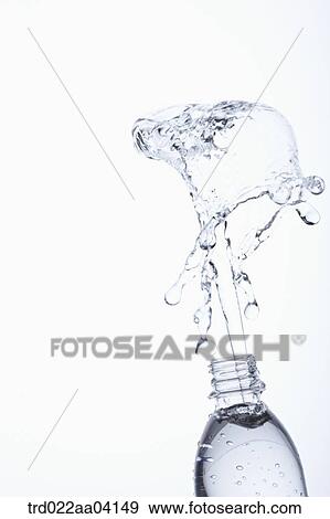 Stock Photo - Spring up water from the bottle. Fotosearch