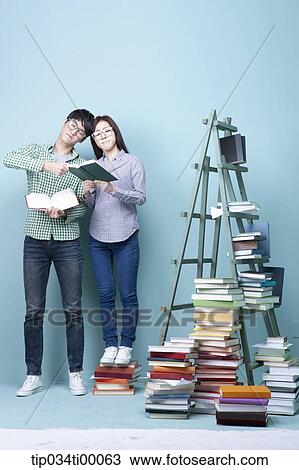 Studying man and woman and competing each other View Large Photo Image Stock Image - Studying man and woman and competing each other. Fotosearch