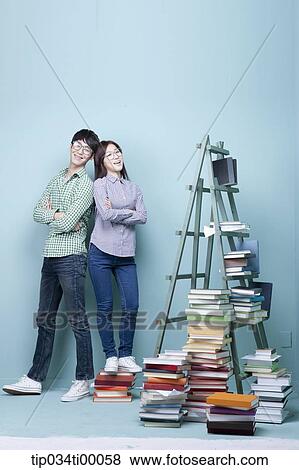 Studying man and woman with the glasses on View Large Photo Image Stock Photo - Studying man and woman with the glasses on . Fotosearch