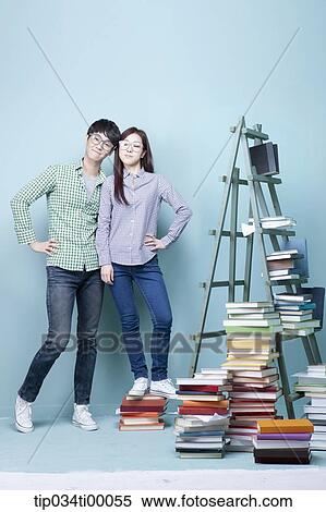 Studying man and woman with the glasses on View Large Photo Image Stock Photography - Studying man and woman with the glasses on . Fotosearch