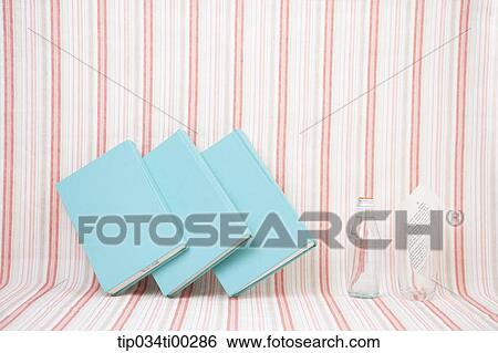 The blue cover book, glass bottle, and paper in glass View Large Photo Image Stock Photograph - The blue cover book, glass bottle, and paper in glass. Fotosearch
