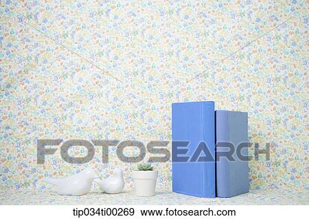 The blue cover books, pot, and bird decorations View Large Photo Image Stock Photo - The blue cover books, pot, and bird decorations. Fotosearch