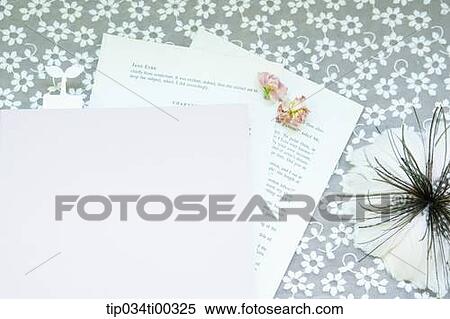 Stock Photography - The book and paper, flower, and green leaves. Fotosearch