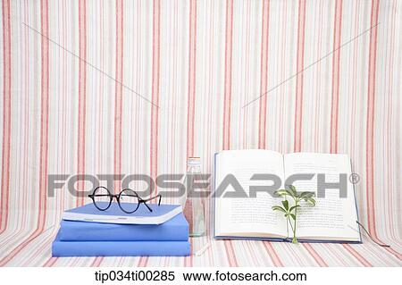 The book, glasses, glass bottle, and plant View Large Photo Image Stock Photography - The book, glasses, glass bottle, and plant. Fotosearch