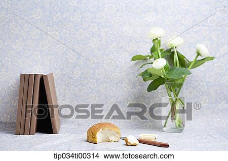 The book, loaf of bread, and flower in vase View Large Photo Image Picture - The book, loaf of bread, and flower in vase. Fotosearch