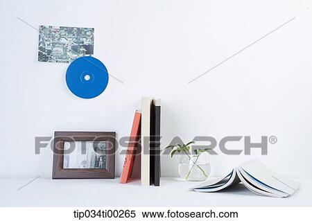 The book, plant, and frame on the table View Large Photo Image Stock Photography - The book, plant, and frame on the table. Fotosearch