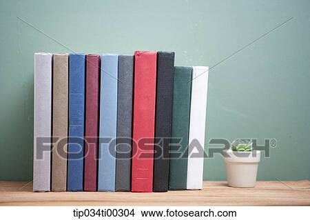 The books and the cactus pot View Large Photo Image Picture - The books and the cactus pot. Fotosearch