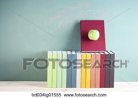 The books and the celebrating word on black board View Large Photo Image Stock Photography - The books and the celebrating word on black board. Fotosearch