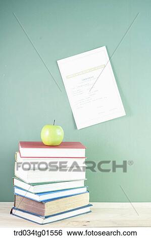 The books and the diploma on black board View Large Photo Image Stock Photograph - The books and the diploma on black board. Fotosearch