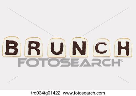 Stock Image - The 'BRUNCH' chocolate syrup on the bread. Fotosearch