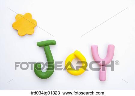 The colorful clay 'JOY' with yellow flower clay View Large Photo Image Stock Image - The colorful clay 'JOY' with yellow flower clay. Fotosearch