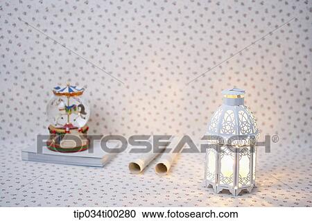 The decoration ball on the book, rolled paper, and light View Large Photo Image Stock Image - The decoration ball on the book, rolled paper, and light . Fotosearch