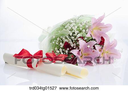 The diploma and the bouquet of flower View Large Photo Image Stock Photo - The diploma and the bouquet of flower. Fotosearch
