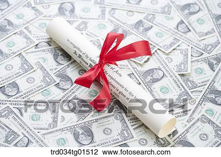 Stock Image - The diploma on the money . Fotosearch