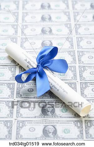 The diploma on the money View Large Photo Image Stock Photo - The diploma on the money . Fotosearch