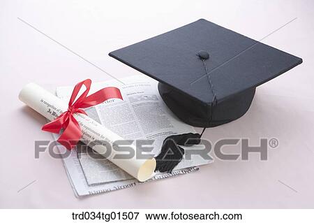 The diploma, the graduation cap, and the newspaper View Large Photo Image Stock Photo - The diploma, the graduation cap, and the newspaper . Fotosearch