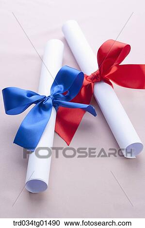 Stock Image - The diploma with blue and red ribbon . Fotosearch