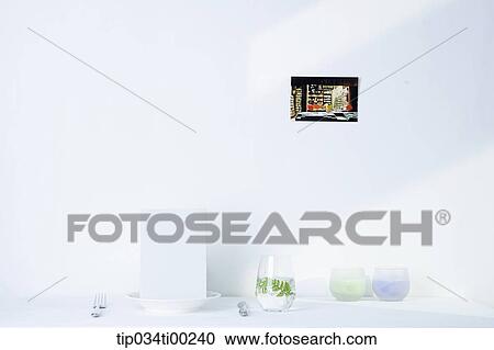 The dish and glasses on the white table View Large Photo Image Stock Image - The dish and glasses on the white table. Fotosearch