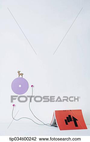 The earphone from the book to purple wall decoration View Large Photo Image Stock Image - The earphone from the book to purple wall decoration. Fotosearch