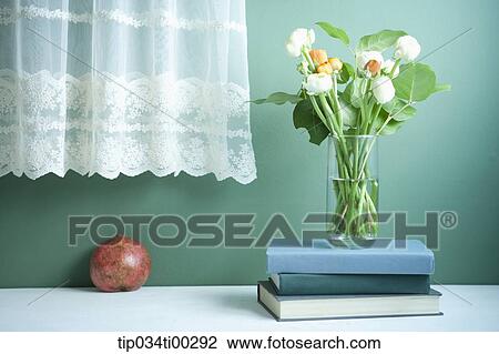 The flower on the books and the pomegranate View Large Photo Image Stock Image - The flower on the books and the pomegranate . Fotosearch
