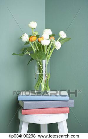 Stock Photo - The flower on the books. Fotosearch