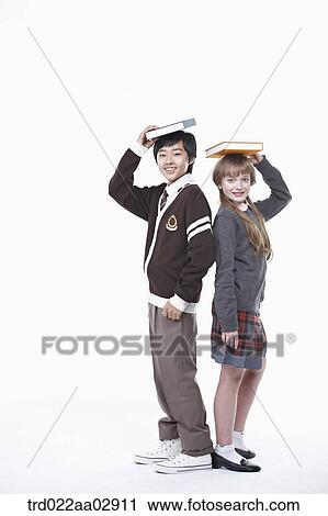 The global students having a book on their heads View Large Photo Image Stock Image - The global students having a book on their heads. Fotosearch