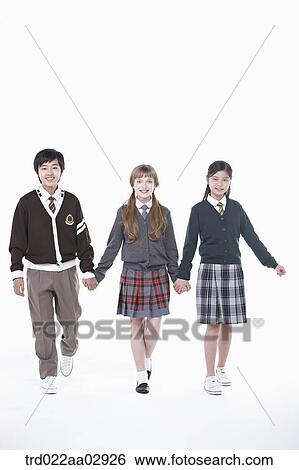 Stock Photograph - The global students holding hands together. Fotosearch