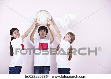 The global students holding up the globe View Large Photo Image Picture - The global students holding up the globe. Fotosearch