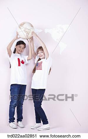The global students holding up the globe View Large Photo Image Stock Image - The global students holding up the globe. Fotosearch