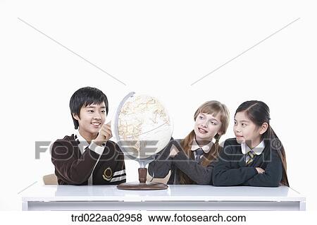 The global students looking at the globe View Large Photo Image Stock Photo - The global students looking at the globe. Fotosearch