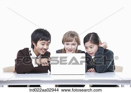 The global students looking at the laptop View Large Photo Image Picture - The global students looking at the laptop . Fotosearch