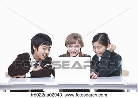 The global students looking at the laptop View Large Photo Image Stock Image - The global students looking at the laptop . Fotosearch