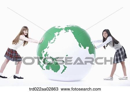 The global students pushing the globe View Large Photo Image Stock Image - The global students pushing the globe. Fotosearch