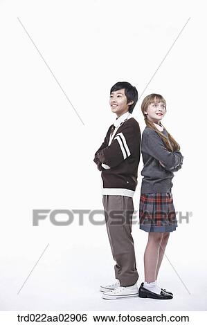 Stock Photograph - The global students standing against each other. Fotosearch