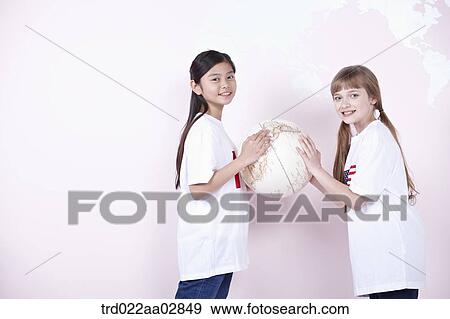 The global students with the globe View Large Photo Image Stock Photo - The global students with the globe. Fotosearch