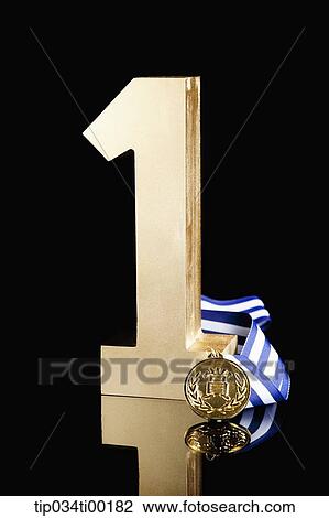 The golden number one and prize medal View Large Photo Image Stock Image - The golden number one and prize medal. Fotosearch