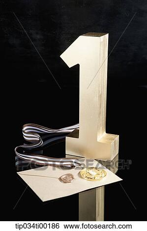 The golden number one, prize medal, and letter of certificate View Large Photo Image Stock Photograph - The golden number one, prize medal, and letter of certificate. Fotosearch