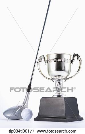 Stock Photo - The golf ball and club with trophy. Fotosearch
