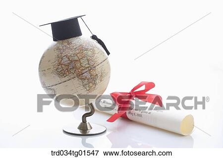 The graduation cap on globe and the diploma View Large Photo Image Stock Photo - The graduation cap on globe and the diploma. Fotosearch