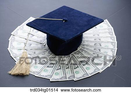 The graduation cap on the money View Large Photo Image Picture - The graduation cap on the money . Fotosearch