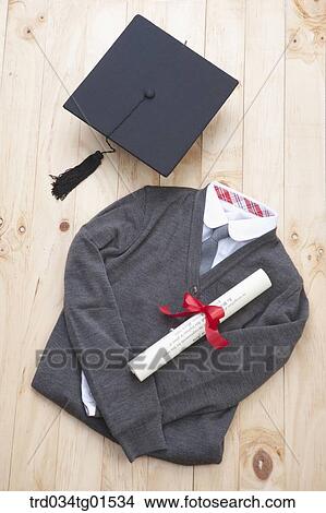 The graduation cap, school uniform, and diploma View Large Photo Image Picture - The graduation cap, school uniform, and diploma. Fotosearch