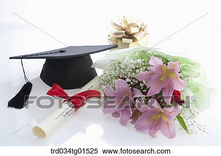 The graduation cap, the diploma, and the bouquet of flower View Large Photo Image Stock Photography - The graduation cap, the diploma, and the bouquet of flower. Fotosearch