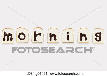 Stock Image - The 'morning' chocolate syrup on the bread. Fotosearch