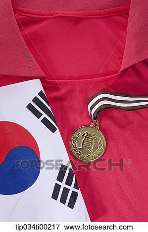 The national flag and prize medal on the national team uniform View Large Photo Image Stock Photo - The national flag and prize medal on the national team uniform . Fotosearch