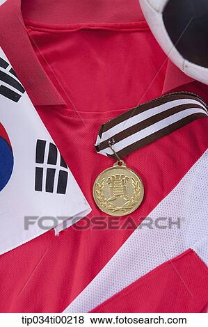 The national flag and prize medal on the national team uniform View Large Photo Image Stock Photo - The national flag and prize medal on the national team uniform . Fotosearch