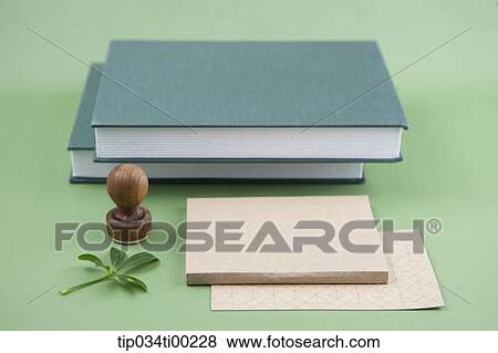 Stock Photo - The note, stamp, leaves, and books. Fotosearch