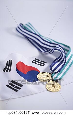 The prize medal on the national flag of South Korea View Large Photo Image Stock Photo - The prize medal on the national flag of South Korea . Fotosearch